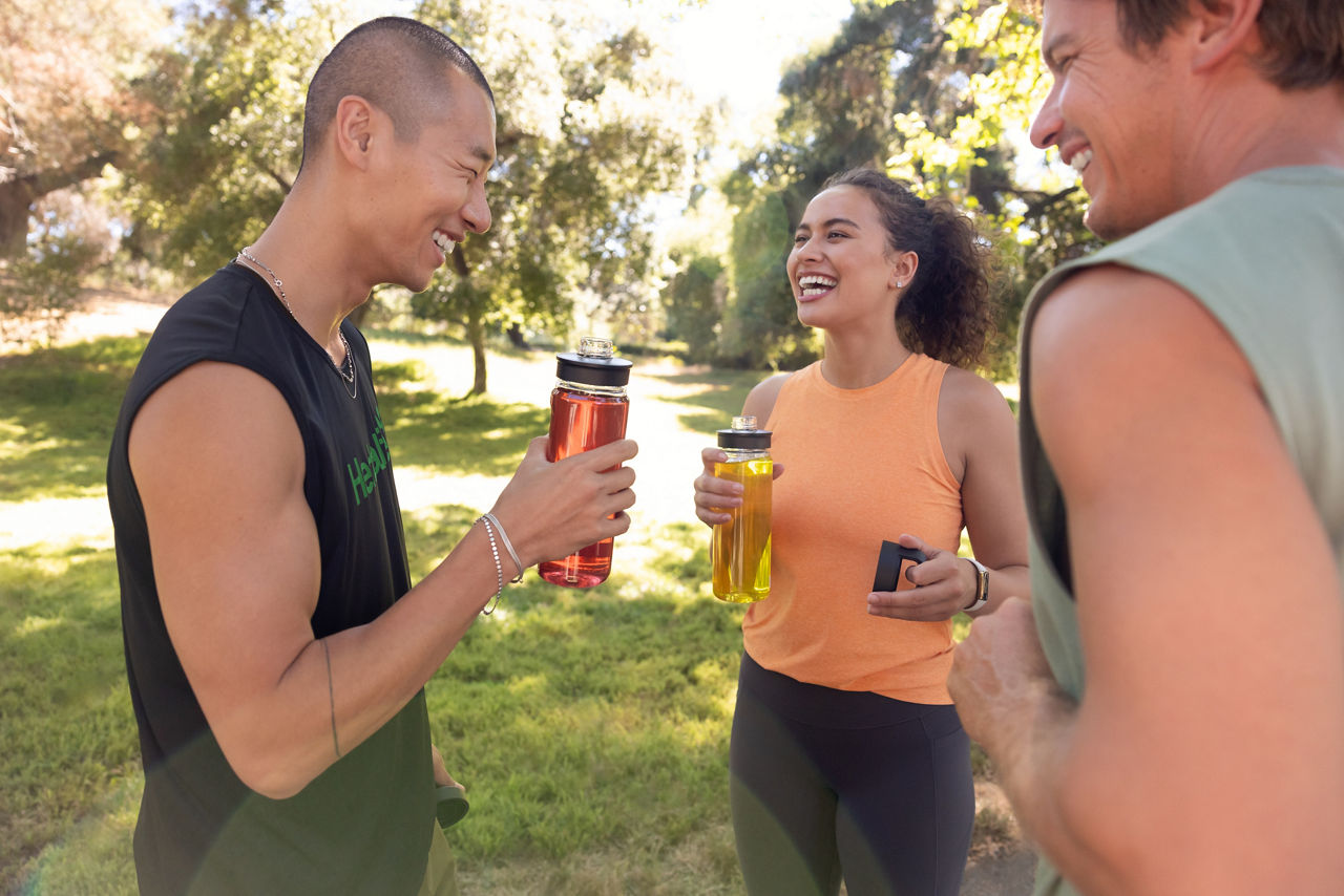 Group of friends relaxing and chatting after their yoga workout