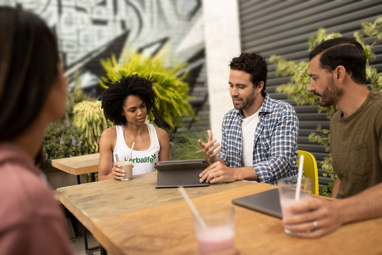 Group of People Drinking Shakes at a Table