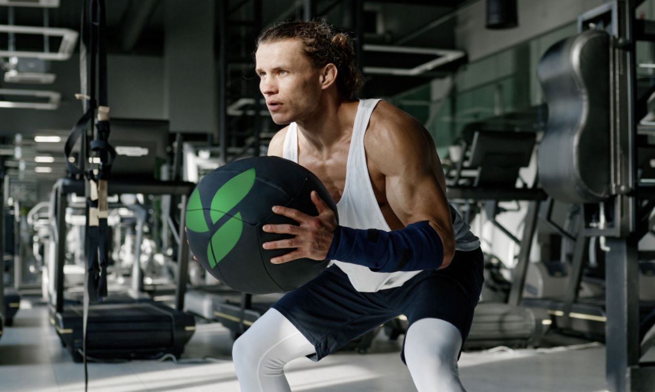 Man training with medicine ball