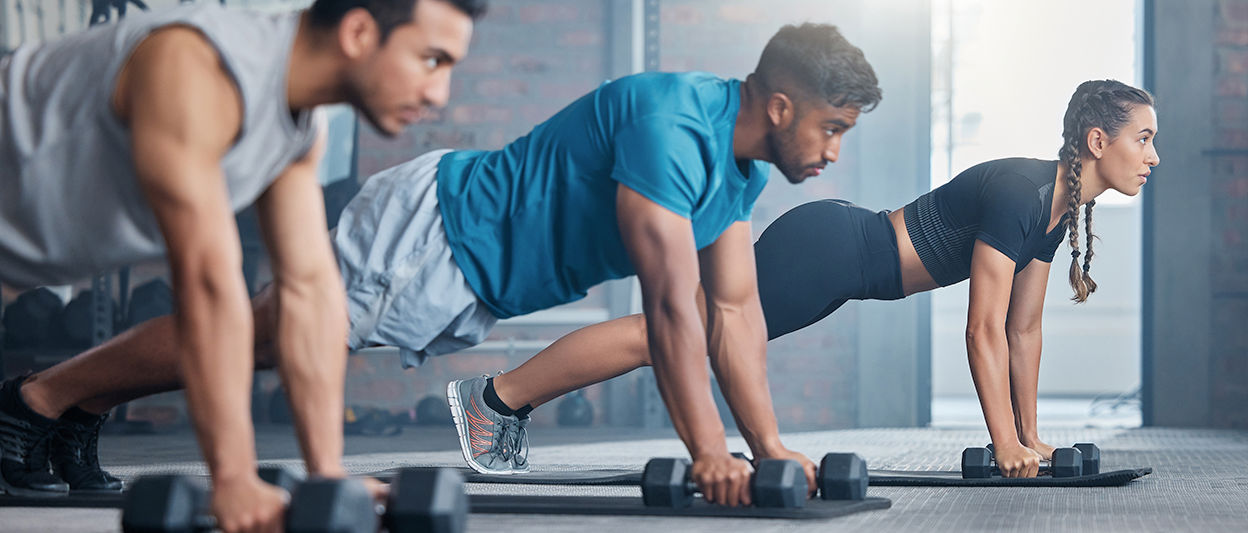 People working out in gym. 